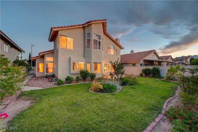 8416 Dry Cliff Cir, Las Vegas, NV 89128 - back of house at dusk featuring stucco siding and a tiled roof