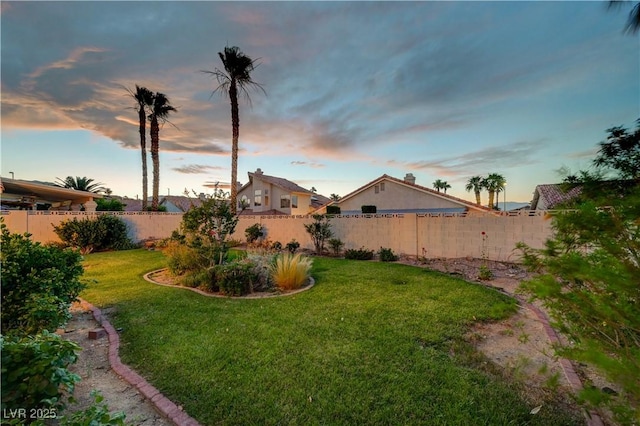 8416 Dry Cliff Cir, Las Vegas, NV 89128 - yard at dusk featuring a fenced backyard