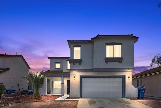 3871 Trellis View Ave, Las Vegas, NV 89115 - view of front of home with a garage, stucco siding, and concrete driveway