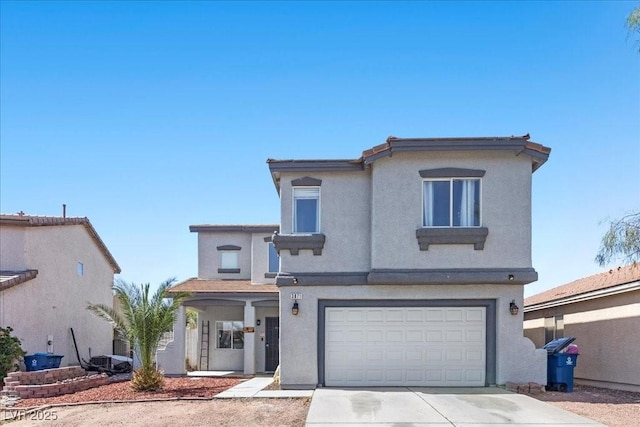 3871 Trellis View Ave, Las Vegas, NV 89115 - view of front of home featuring stucco siding, a garage, and driveway