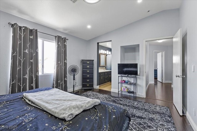 3871 Trellis View Ave, Las Vegas, NV 89115 - bedroom with vaulted ceiling, wood finished floors, and ensuite bath