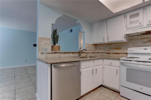 4742 Obannon Dr Unit A, Las Vegas, NV 89102 - kitchen featuring dishwasher, under cabinet range hood, white range with electric cooktop, arched walkways, and backsplash