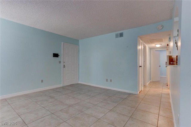 4742 Obannon Dr Unit A, Las Vegas, NV 89102 - spare room with a textured ceiling, light tile patterned floors, and a smoke detector