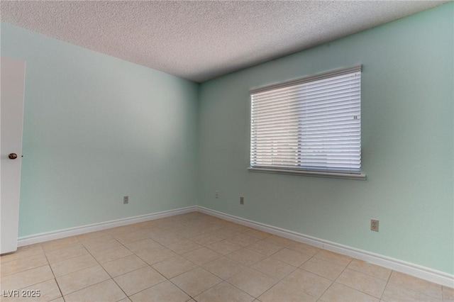 4742 Obannon Dr Unit A, Las Vegas, NV 89102 - spare room featuring a textured ceiling and light tile patterned flooring