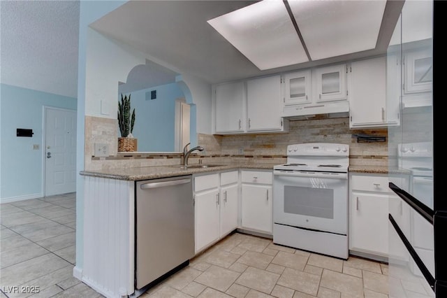 4742 Obannon Dr Unit A, Las Vegas, NV 89102 - kitchen with white electric range oven, stainless steel dishwasher, under cabinet range hood, and white cabinetry