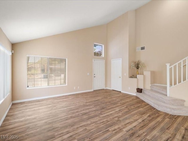 7924 Mcdowell Dr, Las Vegas, NV 89129 - foyer with wood finished floors, high vaulted ceiling, and stairway