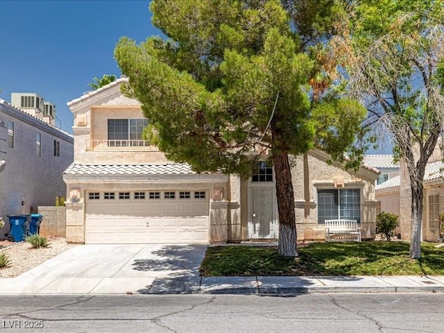 7924 Mcdowell Dr, Las Vegas, NV 89129 - view of front of property with a tile roof, driveway, and a garage