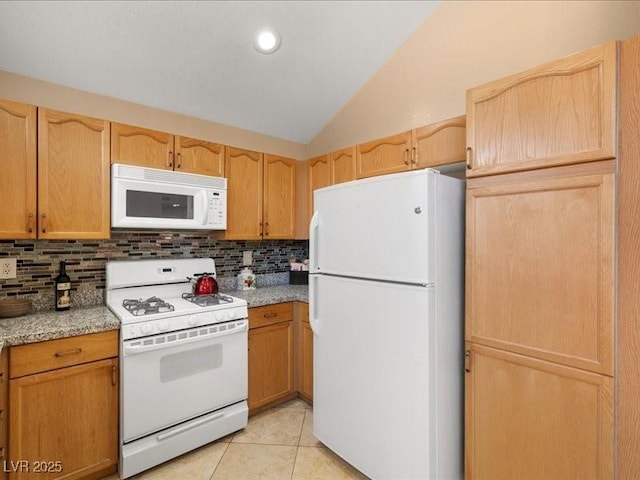 7924 Mcdowell Dr, Las Vegas, NV 89129 - kitchen featuring white appliances, lofted ceiling, decorative backsplash, light countertops, and light tile patterned flooring