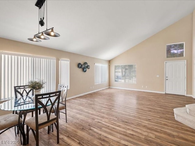 7924 Mcdowell Dr, Las Vegas, NV 89129 - dining space featuring wood finished floors and high vaulted ceiling