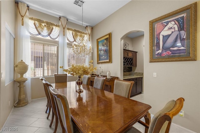 1329 Calle Cantar, Henderson, NV 89012 - dining space with arched walkways and a chandelier