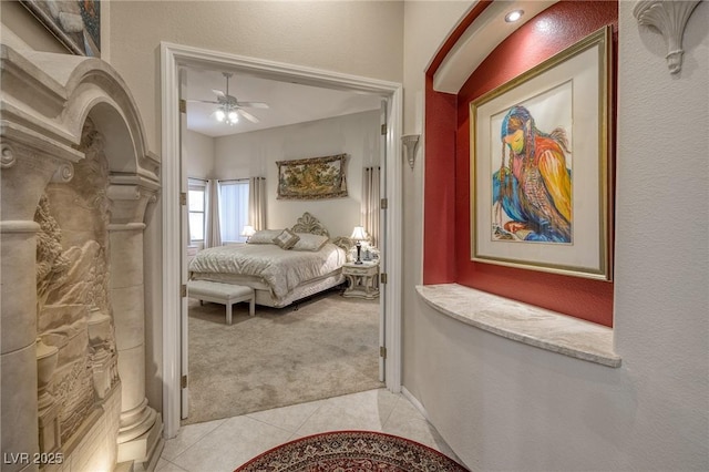 1329 Calle Cantar, Henderson, NV 89012 - bedroom featuring light carpet, light tile patterned flooring, and ceiling fan