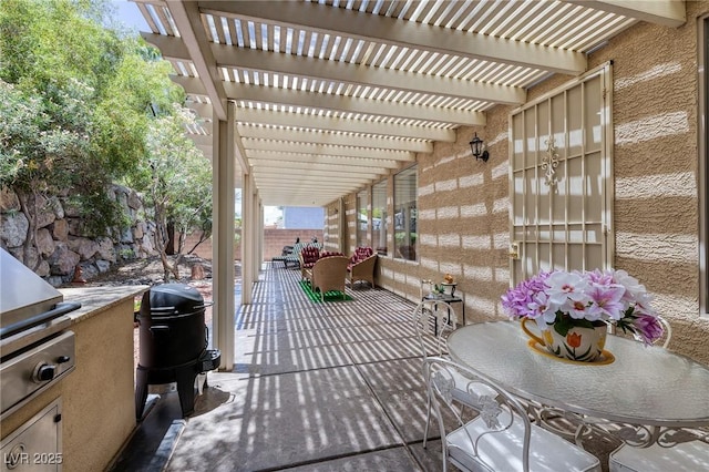 1329 Calle Cantar, Henderson, NV 89012 - view of patio with a pergola and an outdoor kitchen