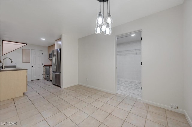 483 Marina Cv, Boulder City, NV 89005 - kitchen featuring appliances with stainless steel finishes, light tile patterned floors, recessed lighting, and decorative light fixtures
