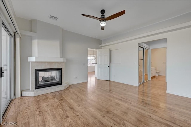 483 Marina Cv, Boulder City, NV 89005 - unfurnished living room featuring a ceiling fan, wood finished floors, and a fireplace