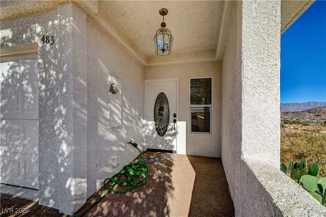 483 Marina Cv, Boulder City, NV 89005 - doorway to property featuring stucco siding and a mountain view