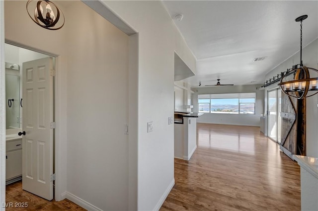 483 Marina Cv, Boulder City, NV 89005 - hallway featuring a chandelier and wood finished floors