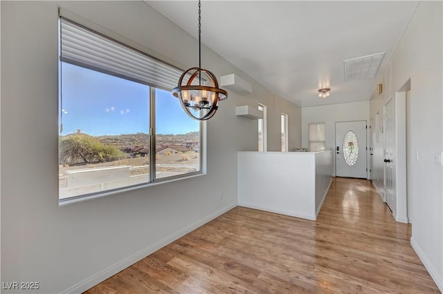 483 Marina Cv, Boulder City, NV 89005 - unfurnished dining area featuring a chandelier and wood finished floors