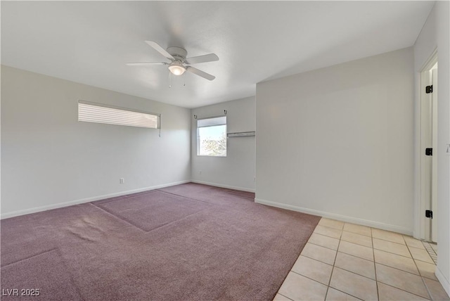 483 Marina Cv, Boulder City, NV 89005 - unfurnished room featuring a ceiling fan, light tile patterned floors, and light colored carpet