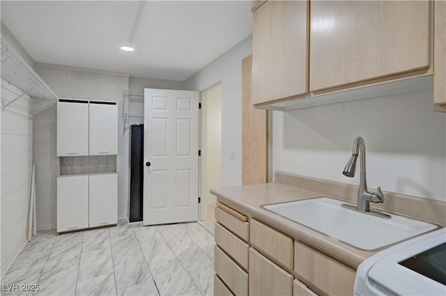 483 Marina Cv, Boulder City, NV 89005 - kitchen with light brown cabinetry, light countertops, and light marble finish floors