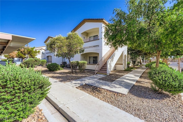 5650 E Sahara Ave Unit 1001, Las Vegas, NV 89142 - view of front of property featuring stairway and stucco siding
