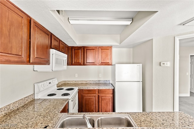 6800 E Lake Mead Blvd Unit 1018, Las Vegas, NV 89156 - kitchen featuring white appliances and brown cabinets