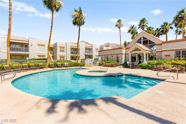 6800 E Lake Mead Blvd Unit 1018, Las Vegas, NV 89156 - community pool featuring a patio, a hot tub, and a residential view