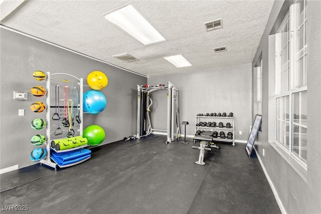 6800 E Lake Mead Blvd Unit 1018, Las Vegas, NV 89156 - exercise area featuring a textured ceiling and baseboards