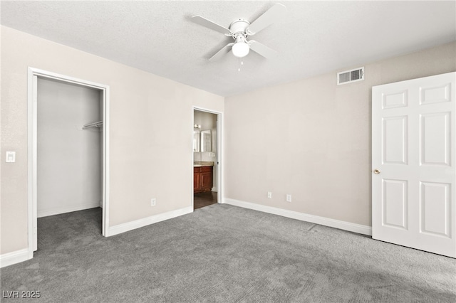6800 E Lake Mead Blvd Unit 1018, Las Vegas, NV 89156 - unfurnished bedroom with carpet, a spacious closet, a closet, and connected bathroom