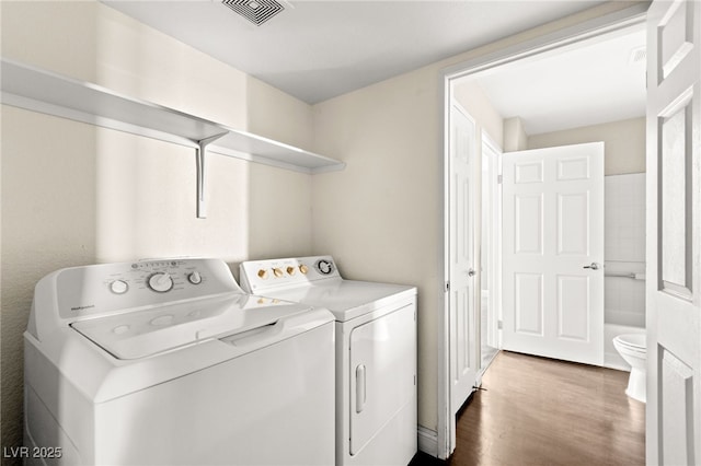 6800 E Lake Mead Blvd Unit 1018, Las Vegas, NV 89156 - laundry area with separate washer and dryer and dark wood-style floors