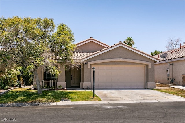 4825 White Aspen Ave, Las Vegas, NV 89130 - view of front of home featuring a garage, driveway, stucco siding, and a tiled roof