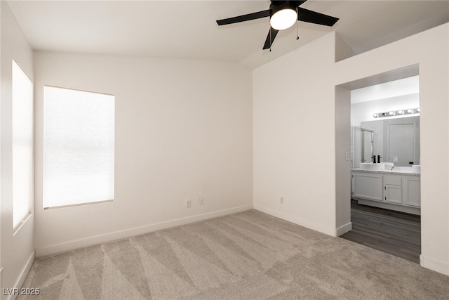 4825 White Aspen Ave, Las Vegas, NV 89130 - unfurnished bedroom with carpet flooring, connected bathroom, and a ceiling fan