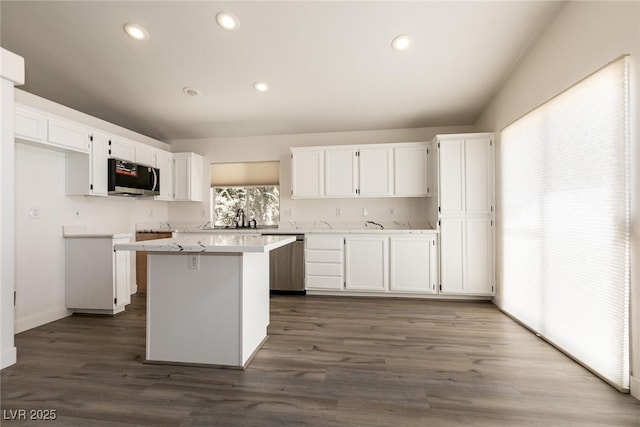 4825 White Aspen Ave, Las Vegas, NV 89130 - kitchen with stainless steel appliances, white cabinets, a center island, light countertops, and recessed lighting