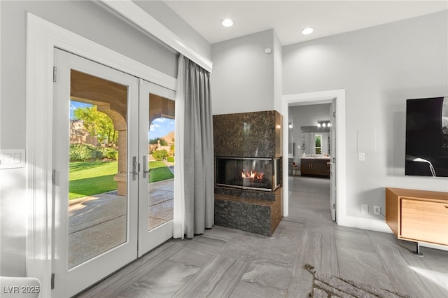 5680 N Fort Apache Rd, Las Vegas, NV 89149 - doorway to outside with french doors and a multi sided fireplace