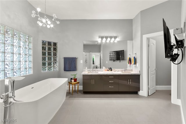 5680 N Fort Apache Rd, Las Vegas, NV 89149 - bathroom featuring a freestanding bath and double vanity