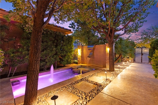 5680 N Fort Apache Rd, Las Vegas, NV 89149 - view of pool featuring a gate, an in-ground hot tub, and a fenced backyard