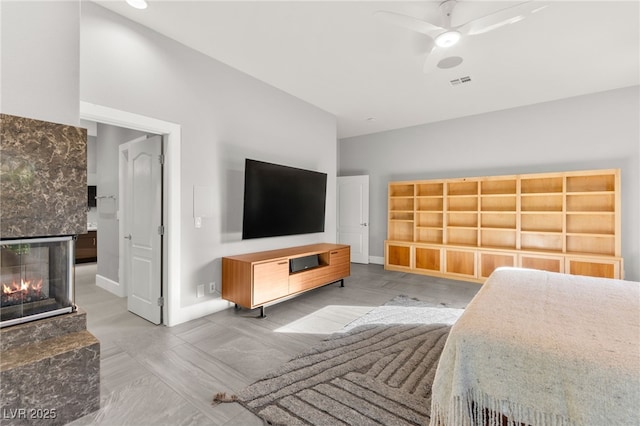 5680 N Fort Apache Rd, Las Vegas, NV 89149 - bedroom featuring a fireplace and a ceiling fan