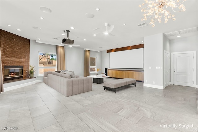 5680 N Fort Apache Rd, Las Vegas, NV 89149 - home theater with a brick fireplace, recessed lighting, and a chandelier