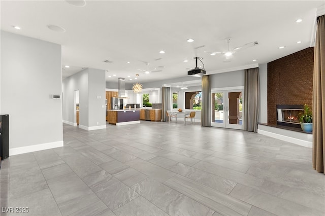 5680 N Fort Apache Rd, Las Vegas, NV 89149 - unfurnished living room featuring a fireplace and recessed lighting