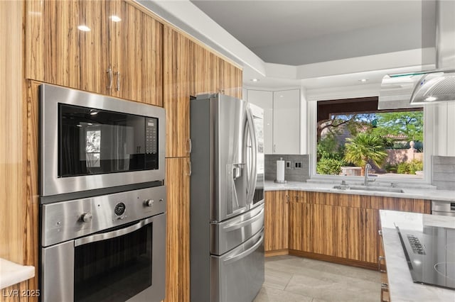 5680 N Fort Apache Rd, Las Vegas, NV 89149 - kitchen with stainless steel appliances, modern cabinets, brown cabinets, and decorative backsplash