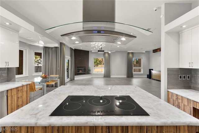 5680 N Fort Apache Rd, Las Vegas, NV 89149 - kitchen featuring black electric stovetop, island exhaust hood, modern cabinets, and recessed lighting