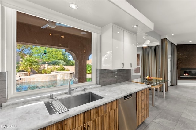 5680 N Fort Apache Rd, Las Vegas, NV 89149 - kitchen featuring dishwasher, modern cabinets, light stone counters, white cabinets, and recessed lighting