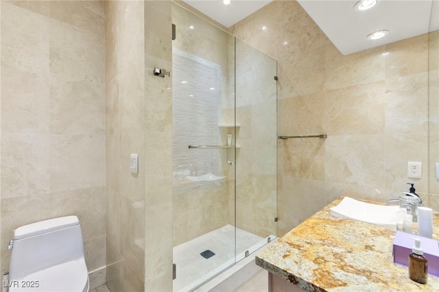 5680 N Fort Apache Rd, Las Vegas, NV 89149 - full bath with tile walls, a shower stall, vanity, and recessed lighting