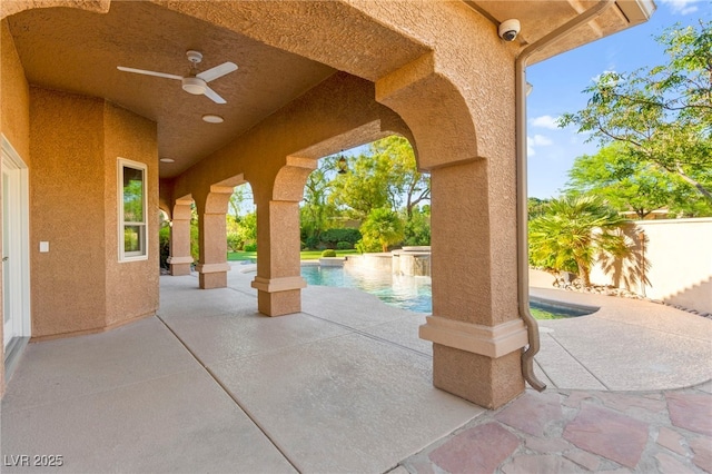 5680 N Fort Apache Rd, Las Vegas, NV 89149 - fenced backyard featuring a patio, a ceiling fan, and an outdoor pool