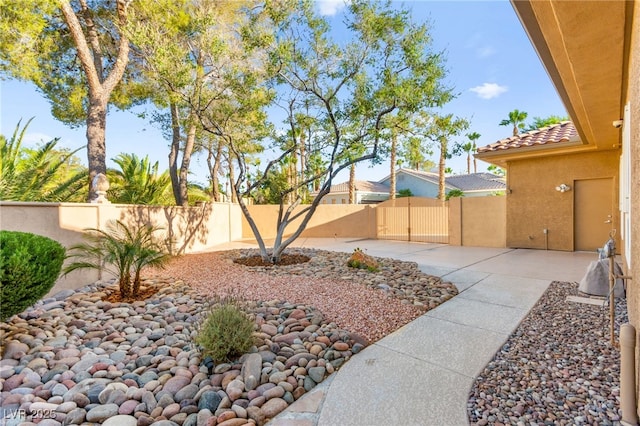 5680 N Fort Apache Rd, Las Vegas, NV 89149 - fenced backyard with a patio area