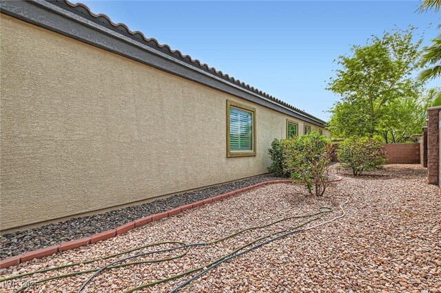 8732 Kendall Brook Cir, Las Vegas, NV 89149 - view of property exterior with stucco siding and a tiled roof