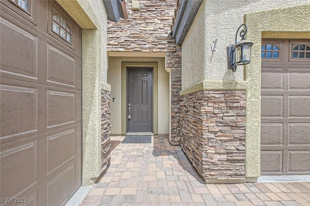 8732 Kendall Brook Cir, Las Vegas, NV 89149 - property entrance featuring stone siding, a garage, and stucco siding