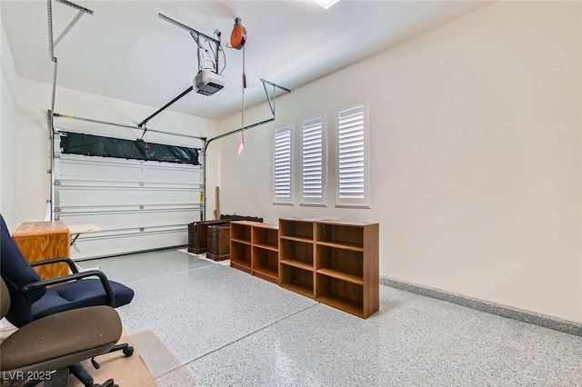 8732 Kendall Brook Cir, Las Vegas, NV 89149 - garage featuring baseboards and a garage door opener