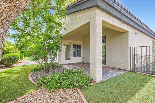 8732 Kendall Brook Cir, Las Vegas, NV 89149 - view of home's exterior with stucco siding and a patio