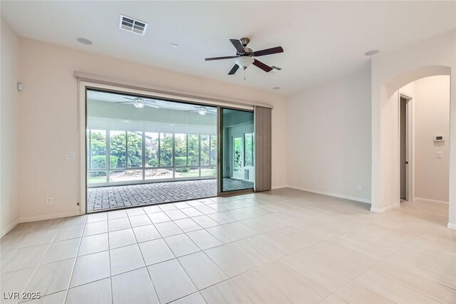 8732 Kendall Brook Cir, Las Vegas, NV 89149 - unfurnished room featuring a ceiling fan, arched walkways, and light tile patterned floors
