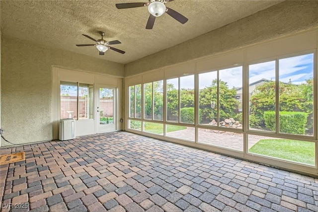 8732 Kendall Brook Cir, Las Vegas, NV 89149 - unfurnished sunroom with a textured ceiling and a textured wall